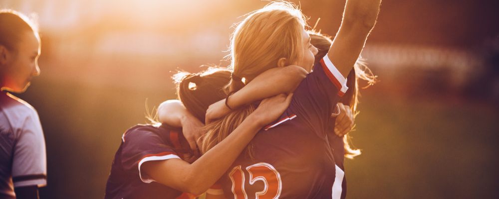 NIL womens soccer team celebrating