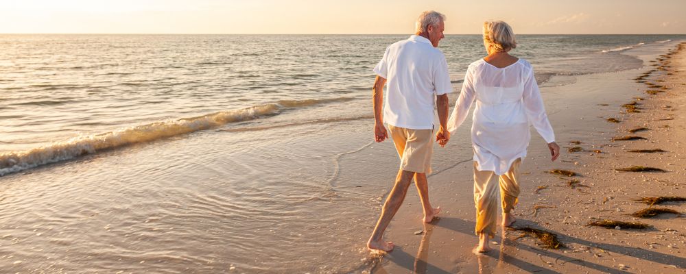 financial planning for retirement couple on beach