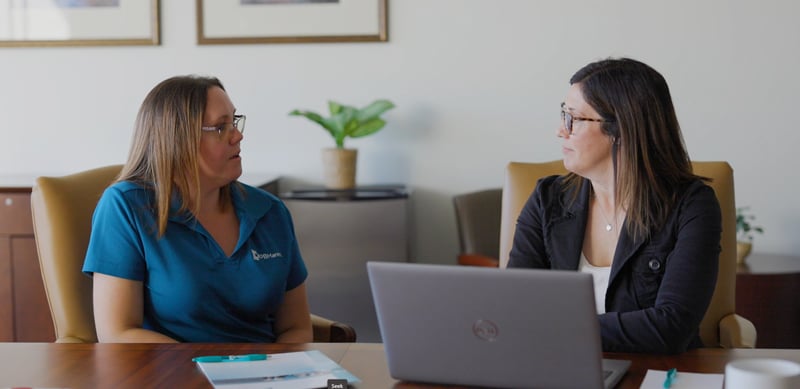 staff discuss onboarding